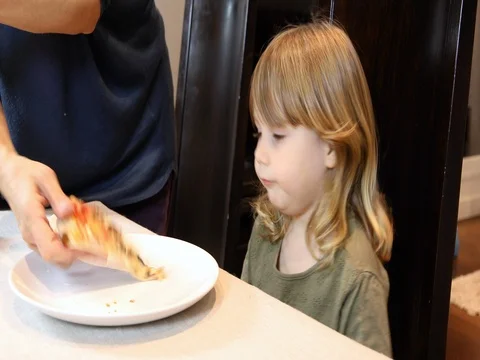 Child eats pizza from side Stock Footage 71405635