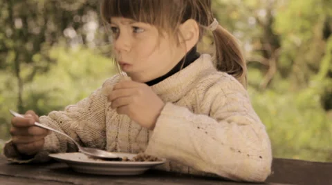 Child eats porridge spoon.Appetizing boy eats porridge Stock Footage 38045400