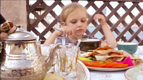 The child eats in the restaurant Video stock 101319041
