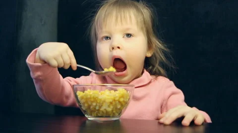 The child eats with spoon Stock Footage 86318581