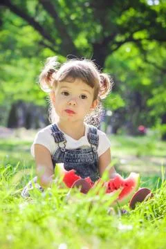 A child eats watermelon. Selective focus. Stock Photos