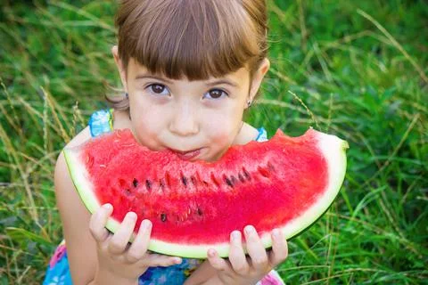 A child eats watermelon. Selective focus. Food Stock Photos