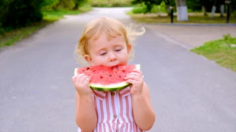 The child eats watermelon in summer. Selective focus. Stock Footage 212529823