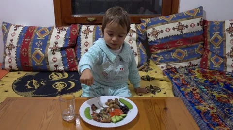 Child eats with zest Video stock 63623213