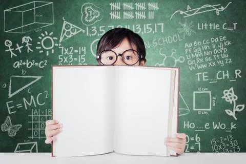 Child with empty book and scribble background Stock Photos