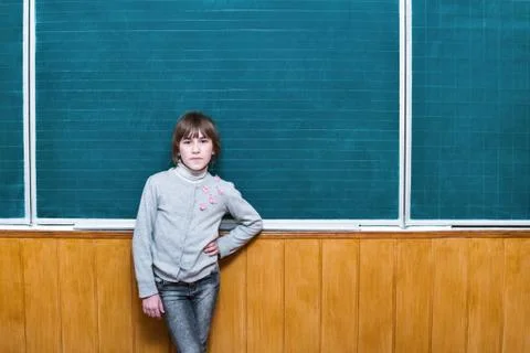 Child at an empty school board Stock Photos