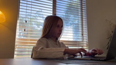 Child engaged in online learning at home Stock Footage 308649847