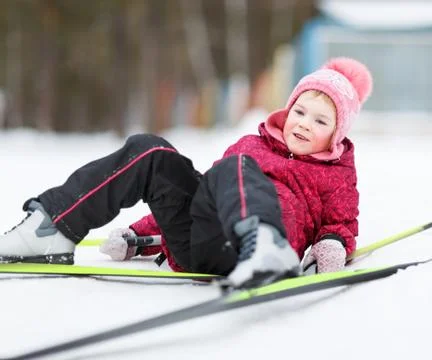 Child engaged in skiing to winter Stock Photos