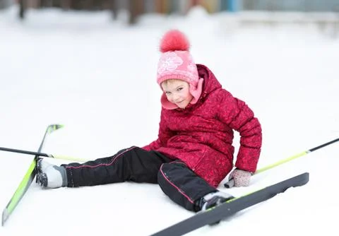 Child engaged in skiing at winter Stock Photos