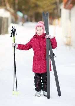 Child engaged in skiing to the winter Stock Photos