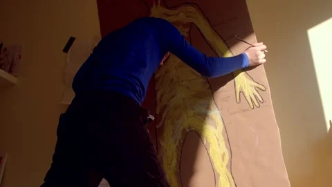 Child Engaging in Learning Human Anatomy through Interactive Drawing Activities Stock Footage 311204455