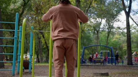 A Child Enjoying Their Time While Playing at a Park Filled with Playground Stock Footage 304685480