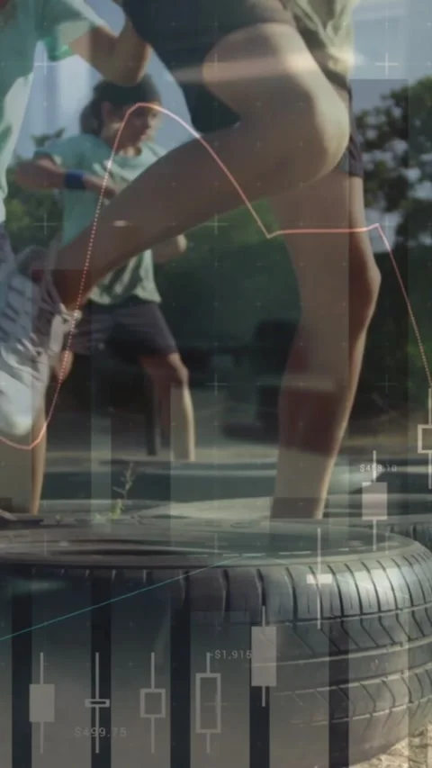 Child entering left and stepping tires, finance chart overlay highlighting Stock Footage 330395994