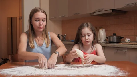 Child examines dough Stock Footage 107046572