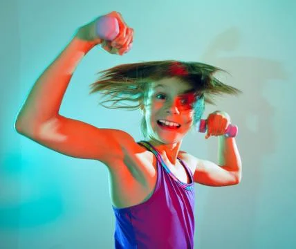 Child exercising with dumbells Stock Photos