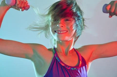 Child exercising with dumbells Stock Photos