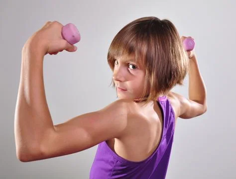 Child exercising with dumbells Stock Photos