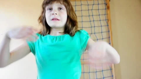 Child  exercising on gymnastic rings Stock Footage 22419645