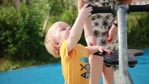 A child explores the carousel Stock Footage 133115582