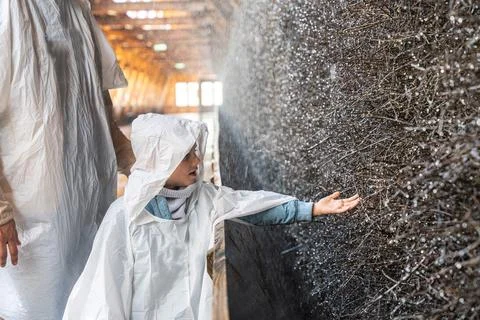 Child Exploring Salt Cave in Protective Suit Stock Photos