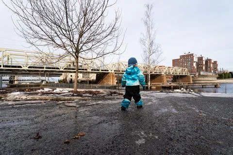 Child exploring spring time in Nordic urban park Stock Photos