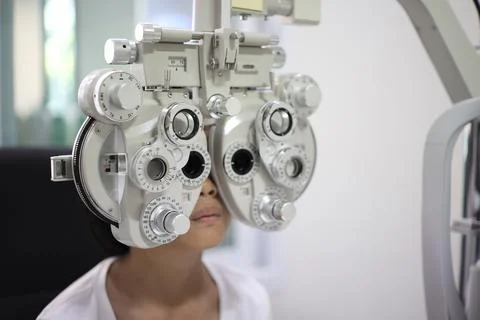Child eye test in optical store 写真素材