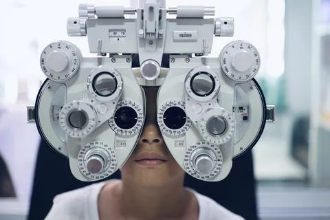 Child eye test in optical store Fotos Stock