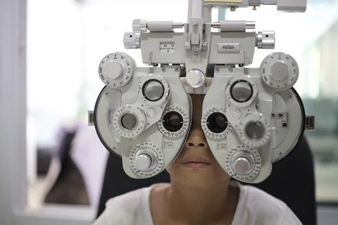 Child eye test in optical store 写真素材