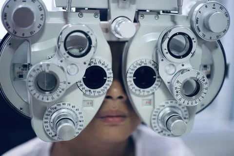 Child eye test in optical store Фото