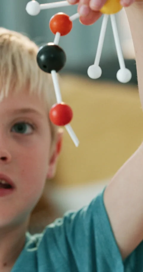 Child, face and happy with molecular structure, growth or development with Stock Footage 336695392
