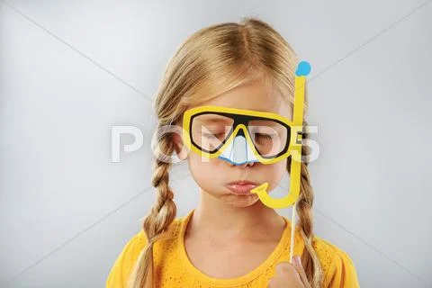Child with fake snorkel isolated on grey Stock Photos