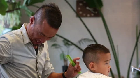 Child falling asleep while getting haircut Stock-Footage 161919144