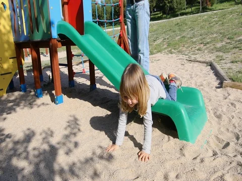 Child falling off the slide Stock Footage 76779680