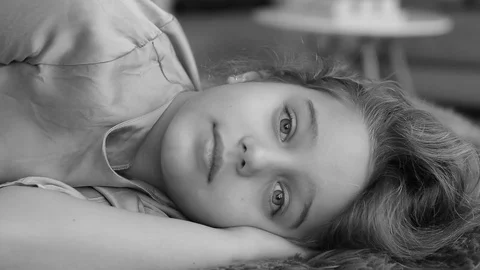 The child falls asleep, dozing, closes his eyes. Amazingly beautiful girl. Stock Footage 71291960