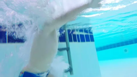 A child falls into water in a pool. Stock Footage 99491826