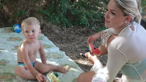 Child feeding slice of watermelon Stock-Footage 68318157