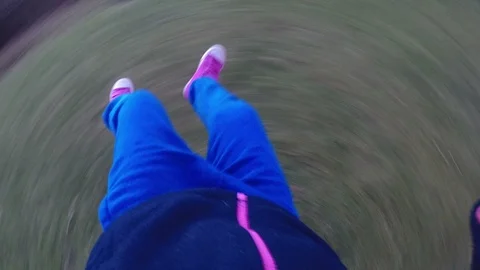 Child feet extended while swinging around Stock Footage 88355872