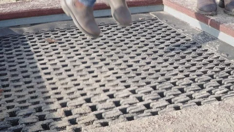 Child feets on trampoline jumping Stock Footage 119604437
