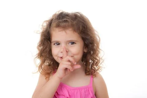Child finger to lips Foto stock