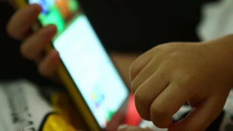Child  finger  touching  smartphone Stock Footage 93679577