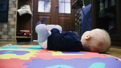 The child first turned over. From the back to the stomach Stock Footage 102031841