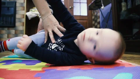 The child first turned over. From the back to the stomach Stock Footage 102031852
