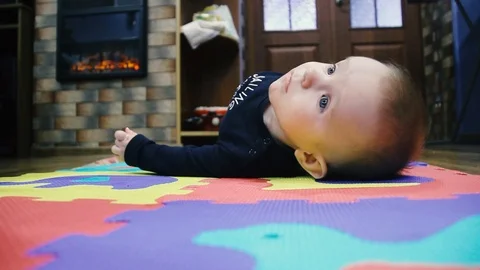 The child first turned over. From the back to the stomach Stock Footage 102031891