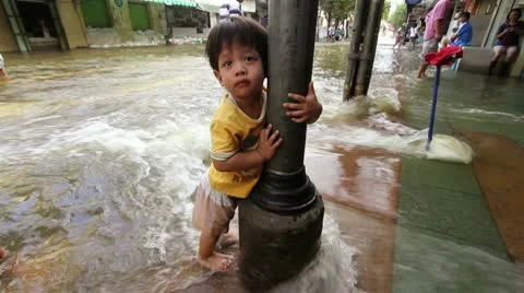 Child in the flood Stock Footage 10476738