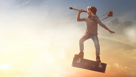 Child flying on a suitcase Stock Footage 103604102