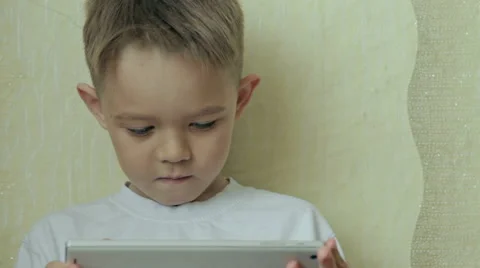 Child focused on screen tablet. Stock Footage 61445350