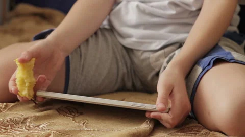 Child focused on screen tablet. Stock Footage 61446225