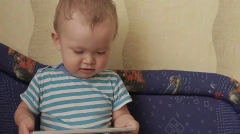 Child focused on screen tablet. Stock Footage 61465103