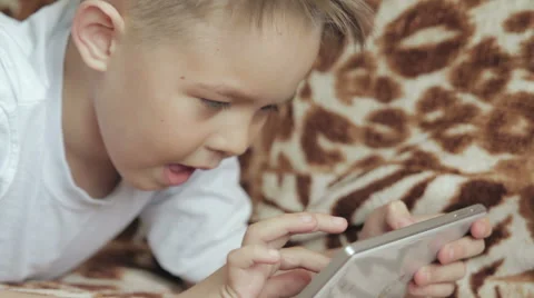 Child focused on screen tablet. Stock Footage 61465809