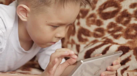 Child focused on screen tablet. Stock Footage 61466105